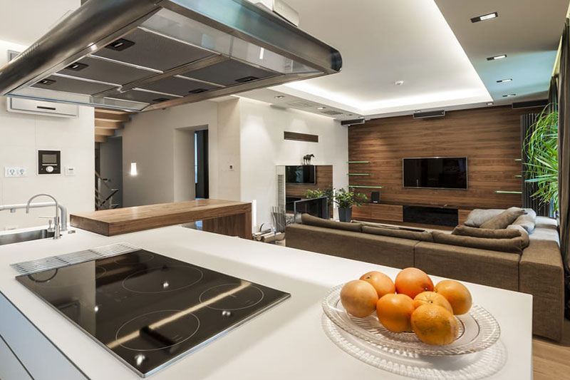 A luxurious kitchen, and oranges on the table