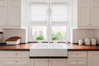 A white and brown kitchen sink